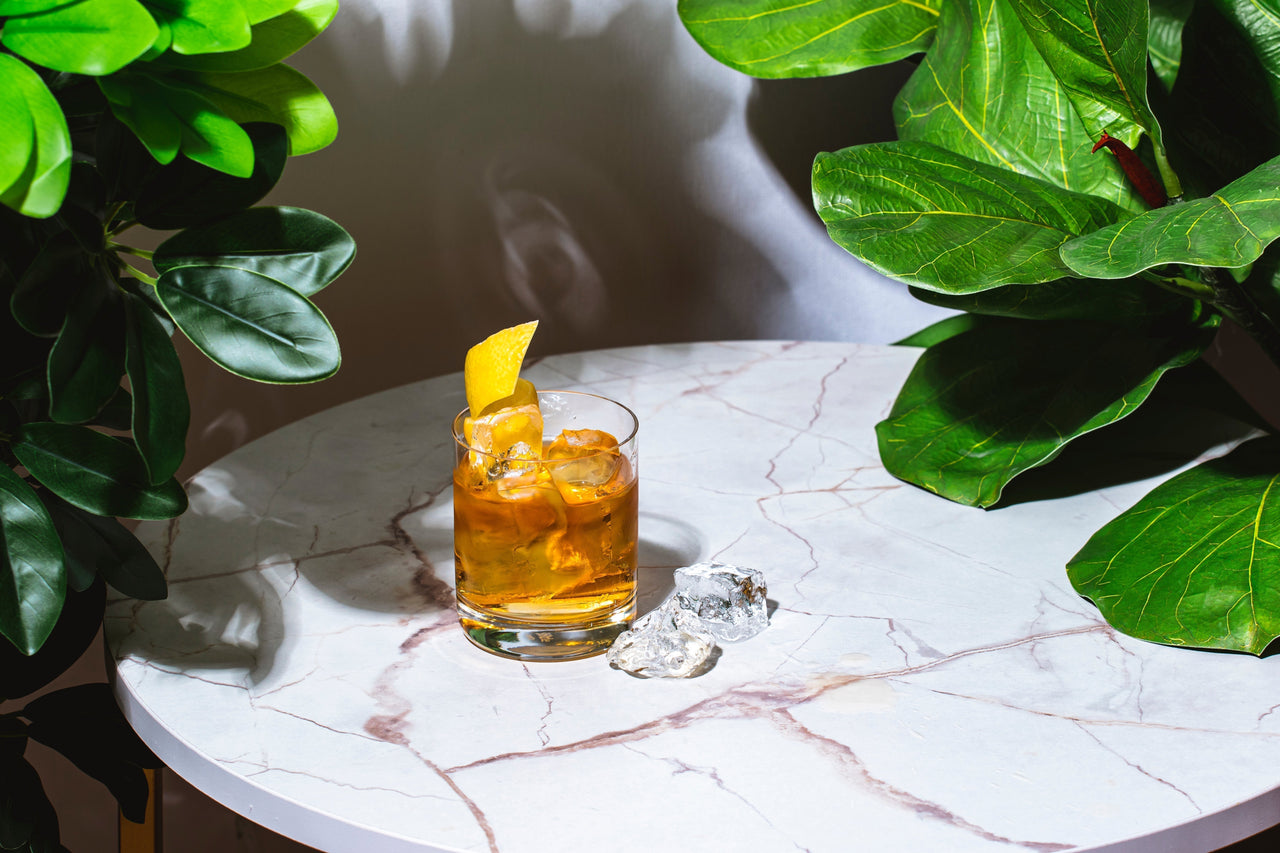 Tequila Old Fashioned in a rocks glass with citrus peel