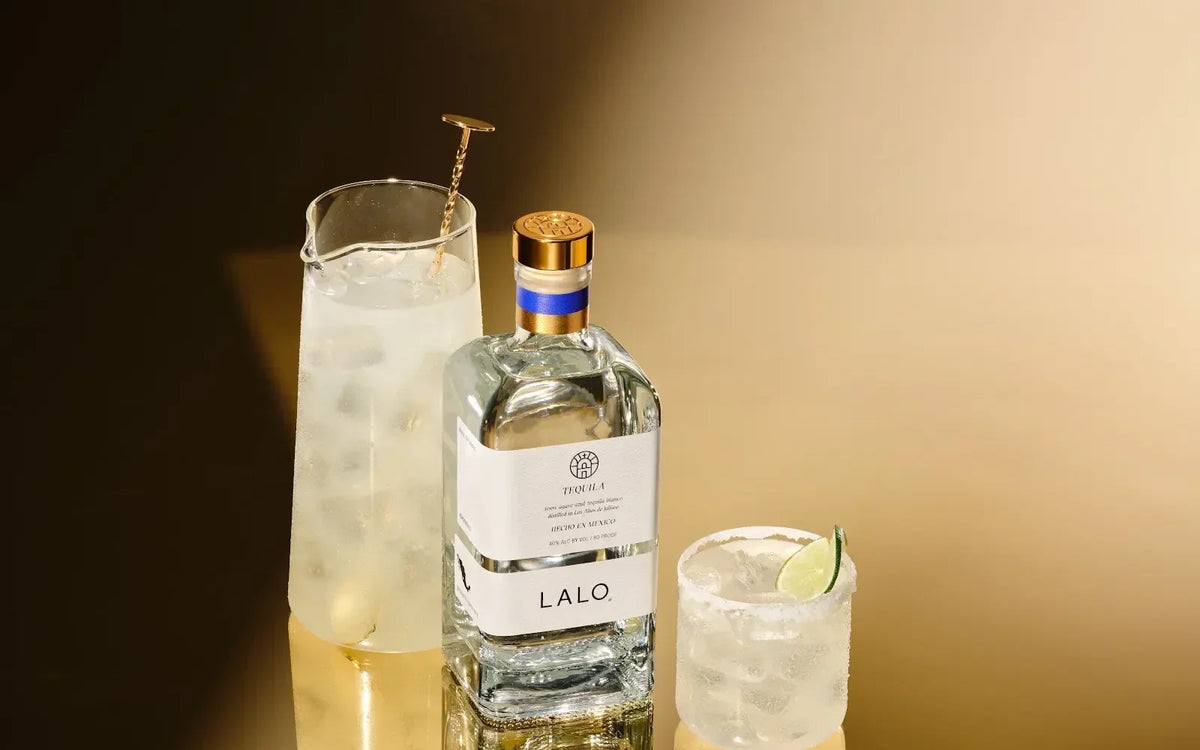 LALO Tequila Blanco with a pitcher and glass of fresh margaritas